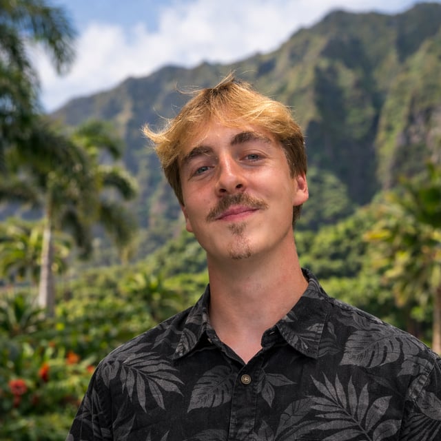 Connor Gehrke, founder of ProScape Hawaii, with Koolau mountains in the background